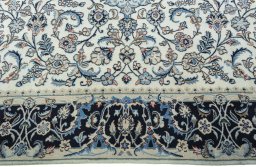 Corner detail of 2000s Kashmar rug showing border pattern and Wool pile