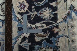 Backside of handmade 2000s Kashmar rug showing knot structure and weave density