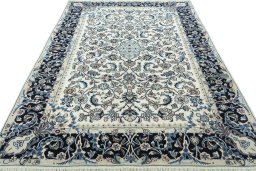 Surface texture of 2000s Kashmar rug with natural Wool and intricate pattern
