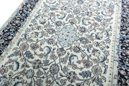 Backside of handmade 2000s Kashmar rug showing knot structure and weave density