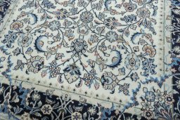 Close-up detail of 2000s Kashmar rug from Iran / Persia showing Wool weave