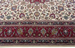 Corner detail of 1970s Kashmar rug showing border pattern and Wool pile