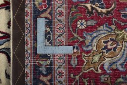Backside of handmade 1970s Kashmar rug showing knot structure and weave density