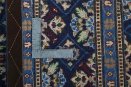 Close-up detail of 2000s Kashmar rug from Iran / Persia showing Wool weave