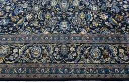 Corner detail of 2000s Kashmar rug showing border pattern and Wool pile
