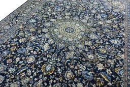 Backside of handmade 2000s Kashmar rug showing knot structure and weave density