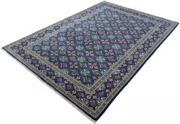 Corner detail of 2000s Kashmar rug showing border pattern and Wool pile