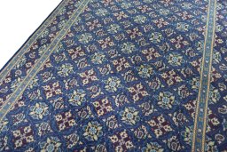 Backside of handmade 2000s Kashmar rug showing knot structure and weave density