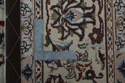 Backside of handmade New Kashmar rug showing knot structure and weave density