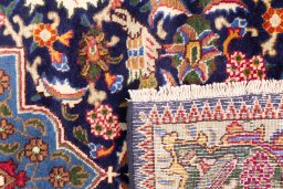 Close-up detail of 1975s Kashmar rug from Iran / Persia showing Wool weave