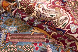 Backside of handmade 1960s Kashmar rug showing knot structure and weave density