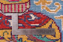 Backside of handmade 1965s Kashmar rug showing knot structure and weave density