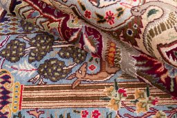 Backside of handmade 1960s Kashmar rug showing knot structure and weave density