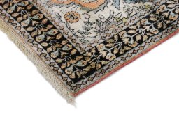 Backside of handmade New Kashmar rug showing knot structure and weave density