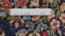 Backside of handmade 1980s Kerman rug showing knot structure and weave density