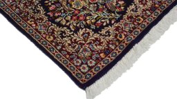 Surface texture of 1970s Kerman rug with natural Wool and intricate pattern