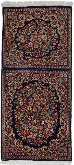 Full view of 1970s Kerman rug from Iran / Persia, 130 × 55 cm in Black tones