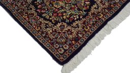 Surface texture of 1970s Kerman rug with natural Wool and intricate pattern