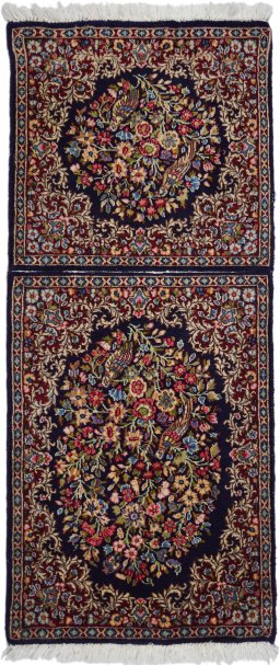 Full view of 1970s Kerman rug from Iran / Persia, 130 × 55 cm in Black tones