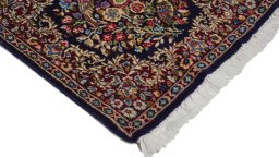 Surface texture of 1970s Kerman rug with natural Wool and intricate pattern