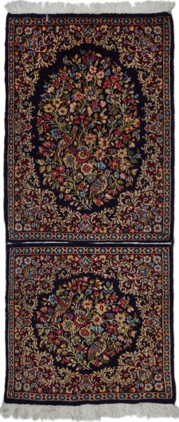 Full view of 1970s Kerman rug from Iran / Persia, 130 × 55 cm in Black tones