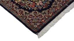 Surface texture of 1970s Kerman rug with natural Wool and intricate pattern