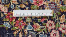 Backside of handmade 1970s Kerman rug showing knot structure and weave density