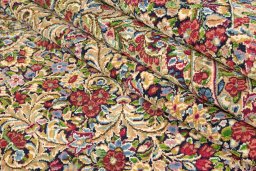 Corner detail of 1970s Kerman rug showing border pattern and Wool pile