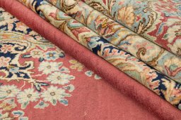 Corner detail of 1950s Kerman rug showing border pattern and Wool pile