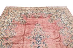 Surface texture of 1950s Kerman rug with natural Wool and intricate pattern