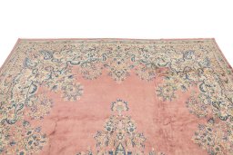 Backside of handmade 1950s Kerman rug showing knot structure and weave density