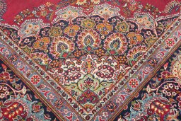 Full view of 1950s Kerman rug from Iran / Persia, 387 × 266 cm in Dark red tones