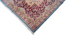 Backside of handmade 1960s Kerman rug showing knot structure and weave density