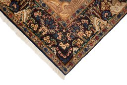 Backside of handmade 1960s Kerman rug showing knot structure and weave density