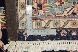 Close-up detail of 1960s Kerman rug from Iran / Persia showing Wool weave