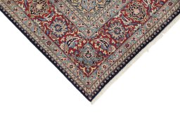 Backside of handmade 1960s Kerman rug showing knot structure and weave density