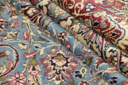 Surface texture of 1960s Kerman rug with natural Wool and intricate pattern