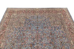 Surface texture of 1960s Kerman rug with natural Wool and intricate pattern