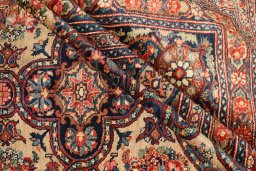 Corner detail of 1900s Kerman rug showing border pattern and Wool pile