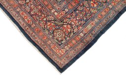 Backside of handmade 1900s Kerman rug showing knot structure and weave density