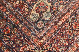 Close-up detail of 1900s Kerman rug from Iran / Persia showing Wool weave