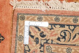 Close-up detail of 1940s Kerman rug from Iran / Persia showing Wool weave
