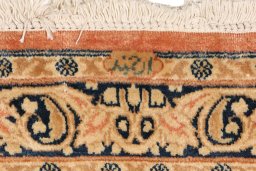 Full view of 1940s Kerman rug from Iran / Persia, 1179 × 109 cm in Terracotta tones
