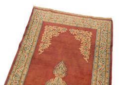 Surface texture of 1950s Kerman rug with natural Wool and intricate pattern