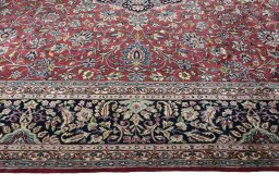Corner detail of 2000s Kerman rug showing border pattern and Wool pile