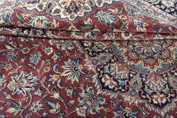 Close-up detail of 2000s Kerman rug from Iran / Persia showing Wool weave