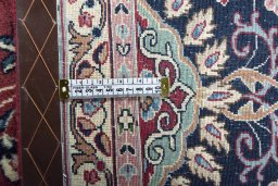 Backside of handmade 2000s Kerman rug showing knot structure and weave density