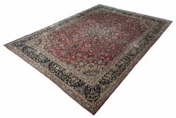 Corner detail of 2000s Kerman rug showing border pattern and Wool pile