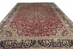 Surface texture of 2000s Kerman rug with natural Wool and intricate pattern