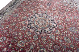 Backside of handmade 2000s Kerman rug showing knot structure and weave density